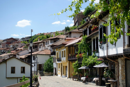 A narrow street with small houses on both sides