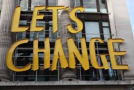  Street sign saying ‘Let’s Change’.  