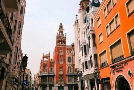 colorful-buildings-line-a-european-street-with-a-tower