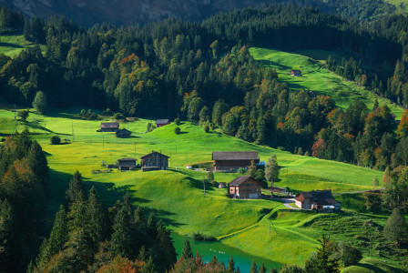 an-aerial-view-of-a-small-village-in-the-mountains