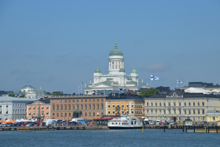 white-and-brown-concrete-building-near-body-of-water-during-daytime