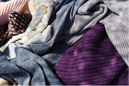 Various types of clothing gathered in an untidy manner