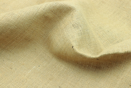 A close-up view of beige fabric. 