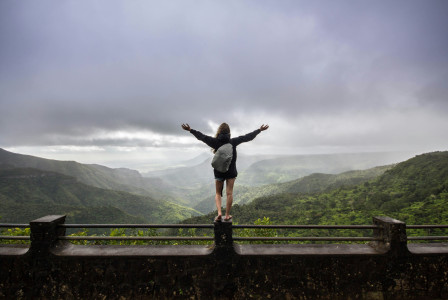 person-standing-on-concrete-railings