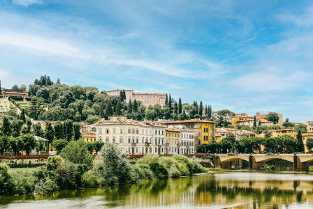 a-river-with-a-bridge-and-buildings-in-the-background
