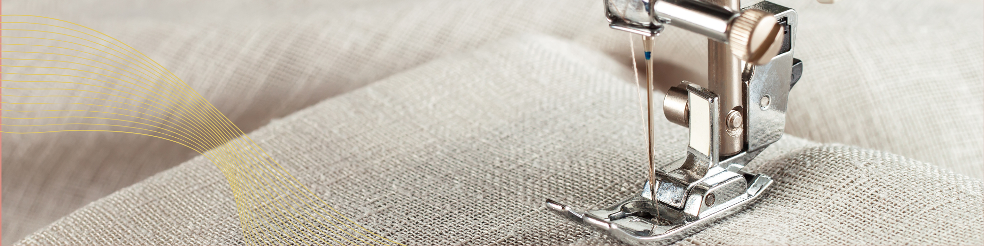 Close-up of a sewing machine stitching beige fabric.