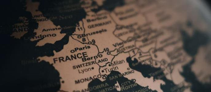Close-up of a globe showing Europe, with country names and cities