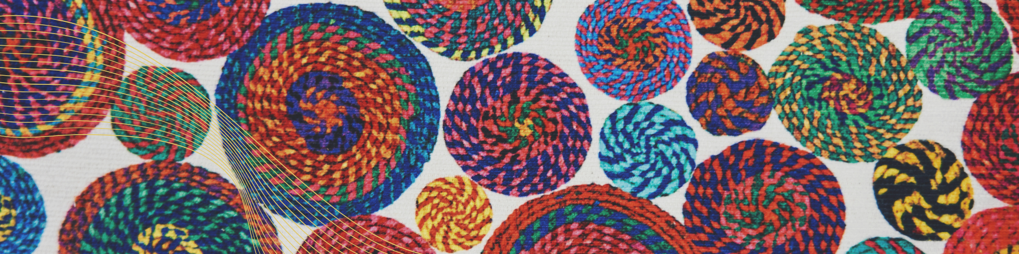 Colourful woven circles in vibrant spiral patterns.