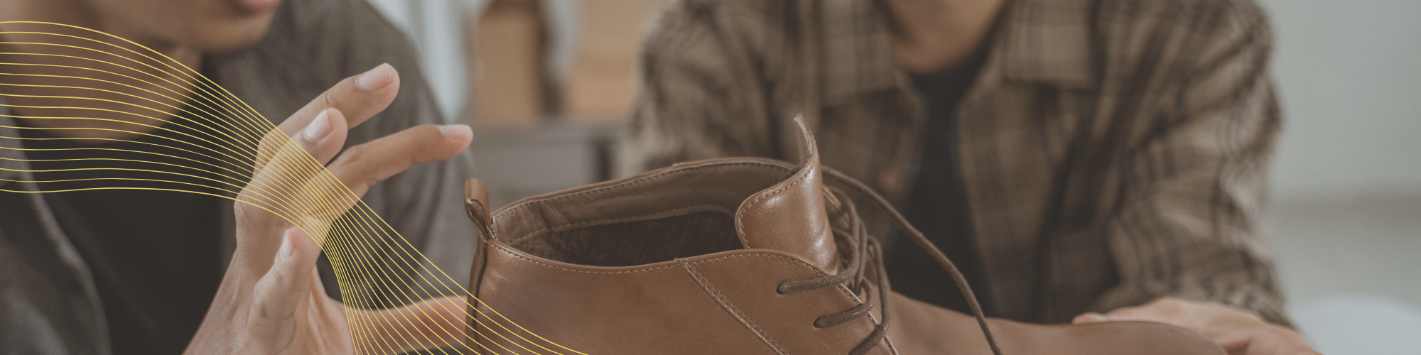 Two professionals discussing a footwear product.