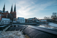 river-bank-by-white-and-brown-buildings-during-daytime