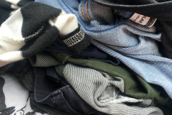 Colour photograph of denim jeans and other cllothes, by Alejo Reinoso on unsplash.