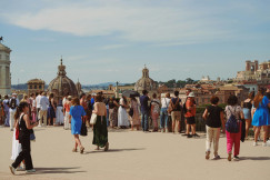 a-large-group-of-people-walking-around-a-building