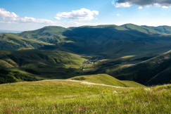 a-valley-with-mountains-in-the-background