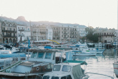a-harbor-filled-with-lots-of-boats-next-to-tall-buildings