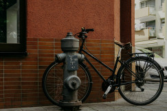 a-bicycle-is-parked-next-to-a-fire-hydrant