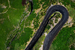 an-aerial-view-of-a-winding-road-in-the-mountains