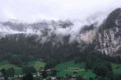 a-view-of-a-valley-with-a-mountain-in-the-background