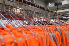 Hanging orange clothes lot.