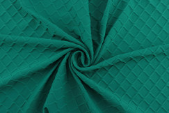 emerald green stretch fabric close up