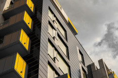The picture presents a block of flats. 
