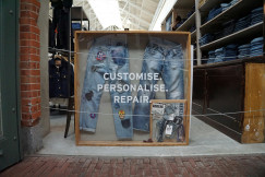 frame containing jeans with patches 