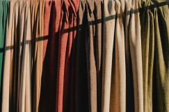 Different colours of curtains made from same textile.