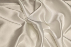 close up of beige silk fabric 