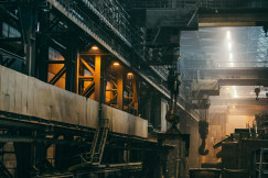 The photo presents the interior of a large industrial factory.