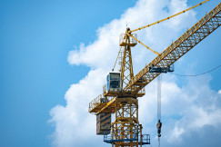 The picture shows infrastructure and equipment used in the construction of large residential developments.