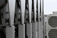 Copilot said:  The picture shows a row of industrial HVAC or cooling units installed outdoors.