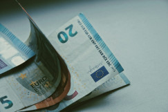 The photo presents euro banknotes.