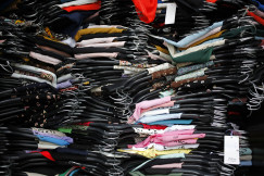 A pile of clothes that are sitting on a table.