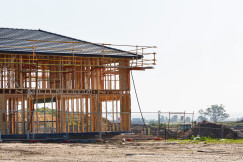 The picture shows construction activity on a building site.  