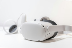 The photo presents a virtual reality headset and controllers.