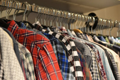 Colourful patterned shirts displayed on clothing racks, representing textile products, fabrics and retail sourcing.