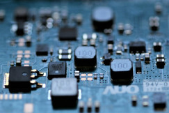 The photo presents a computer circuit board.