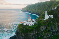 The photo presents a lighthouse near Ribeira Grande in the Azores, Portugal.
