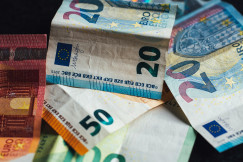 The photo presents euro banknotes.