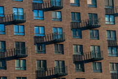 The picture shows the facade of a modern residential apartment building.