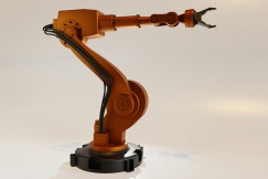 The image presents an industrial robotic arm.