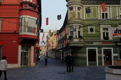 The picture describes a pedestrian street in the historic centre of Celje, Slovenia.