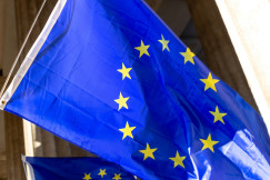 A blue and yellow flag with yellow stars on it.
