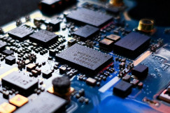 The photo presents a computer circuit board.