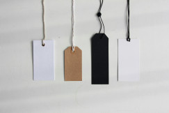 Four paper card tags.
