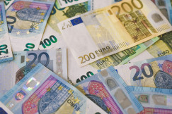 The photo presents different euro banknotes.