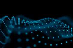 blue abstract image with dotted baby blue lights forming waves