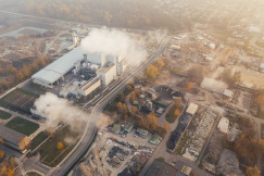 This picture shows an aerial view of a large industrial complex, surrounded by roads, storage areas, trees, and other industrial facilities.