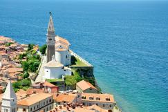 An illustrative photo of a coastal scene with a church