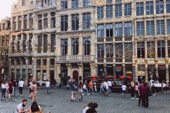 An illustrative photo of people sitting on the ground in Belgium