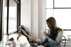An illustrative photo of a woman working on the laptop